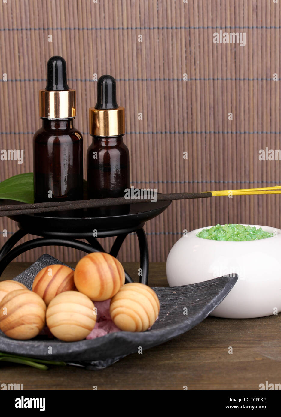 aromatherapy setting on brown bamboo background Stock Photo - Alamy