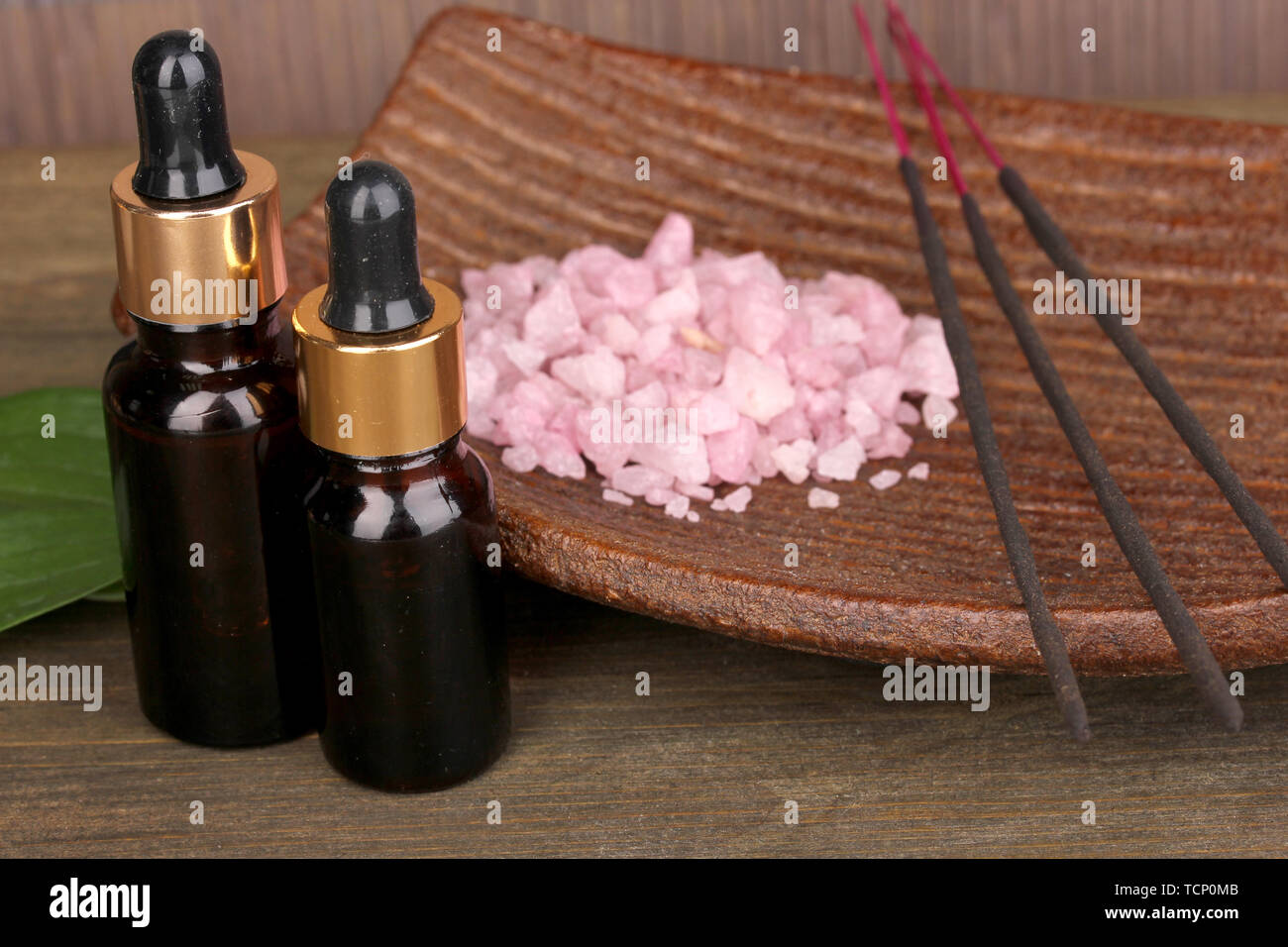 aromatherapy setting on brown bamboo background Stock Photo - Alamy