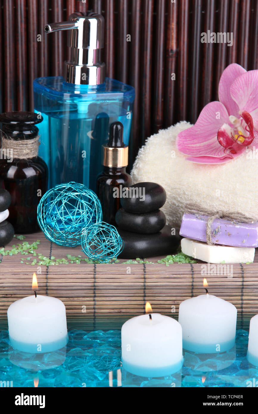 Beautiful spa setting near pool on bamboo background Stock Photo - Alamy