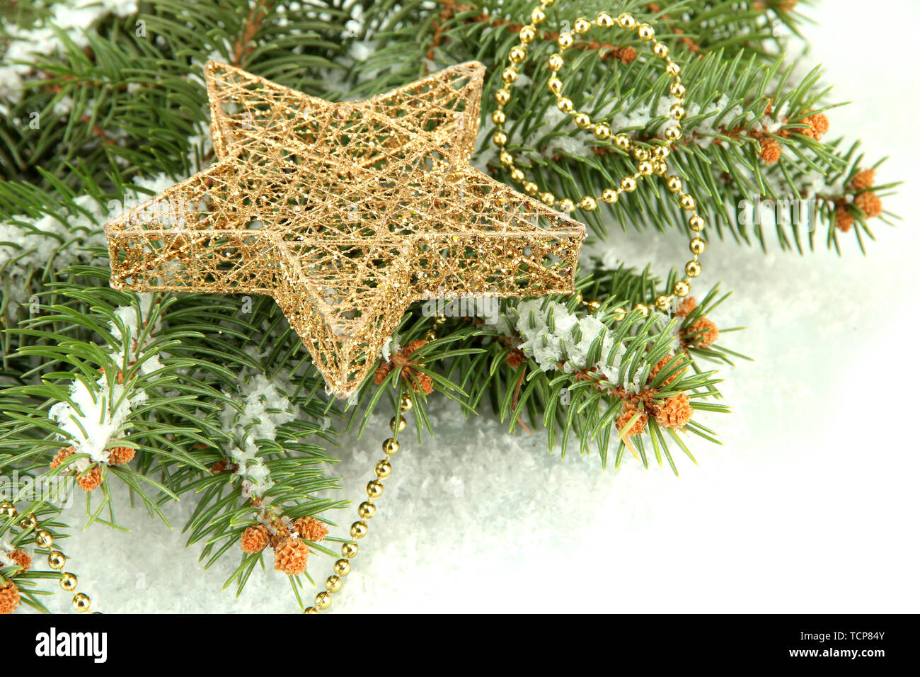 Christmas star on fir tree with snow, isolated on white Stock Photo - Alamy