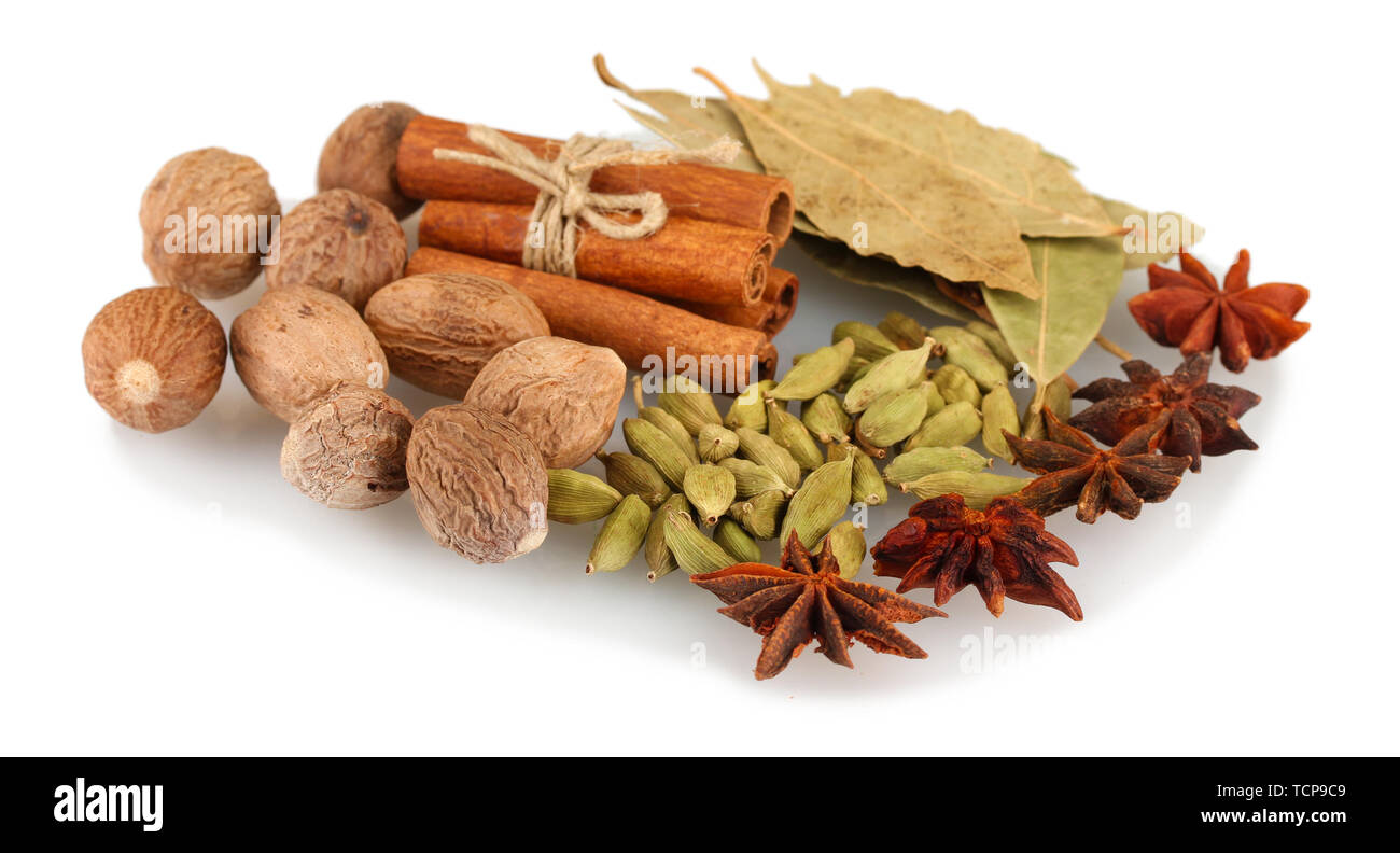 Nutmeg and other spices isolated on white Stock Photo Alamy