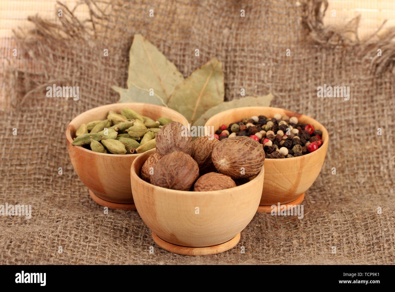 Nutmeg and other spices on sackcloth background Stock Photo Alamy