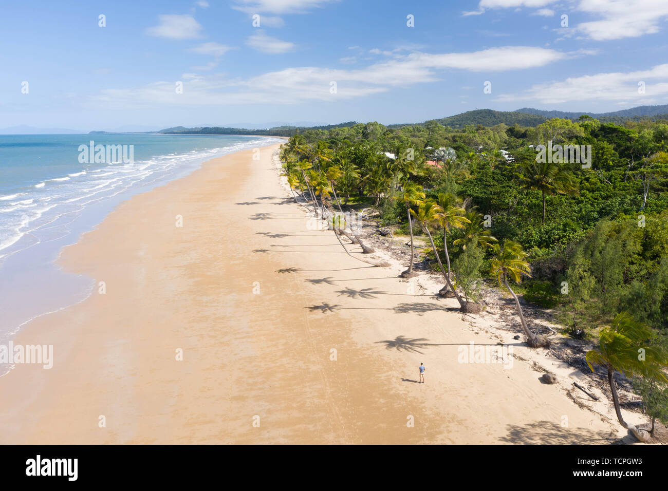 Aerial top view of beach with white sand, beautiful palm trees and warm turquoise tropical water in tropical paradise island, tropics Stock Photo