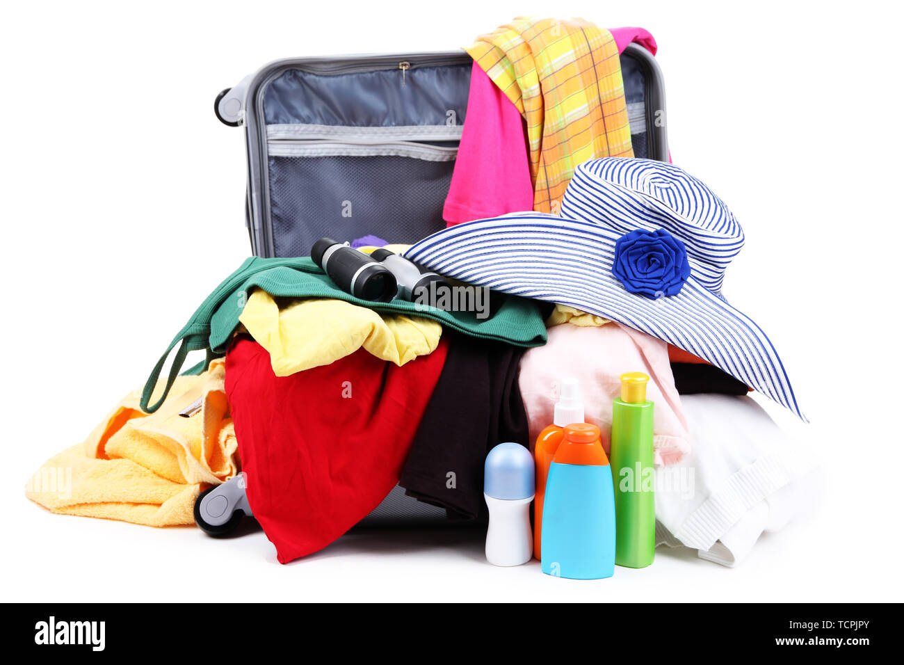 Open silver suitcase with clothing isolated on white Stock Photo Alamy