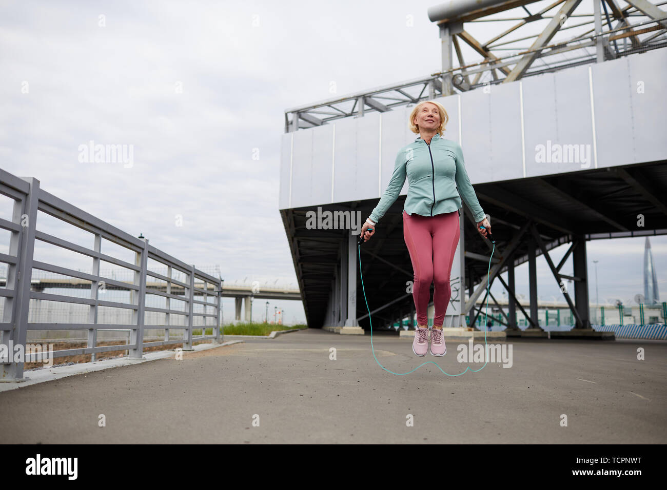 Senior woman jumping rope hi-res stock photography and images - Alamy