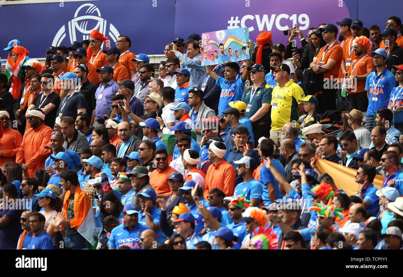 Australia fans stand in the India fan section during the ICC cricket