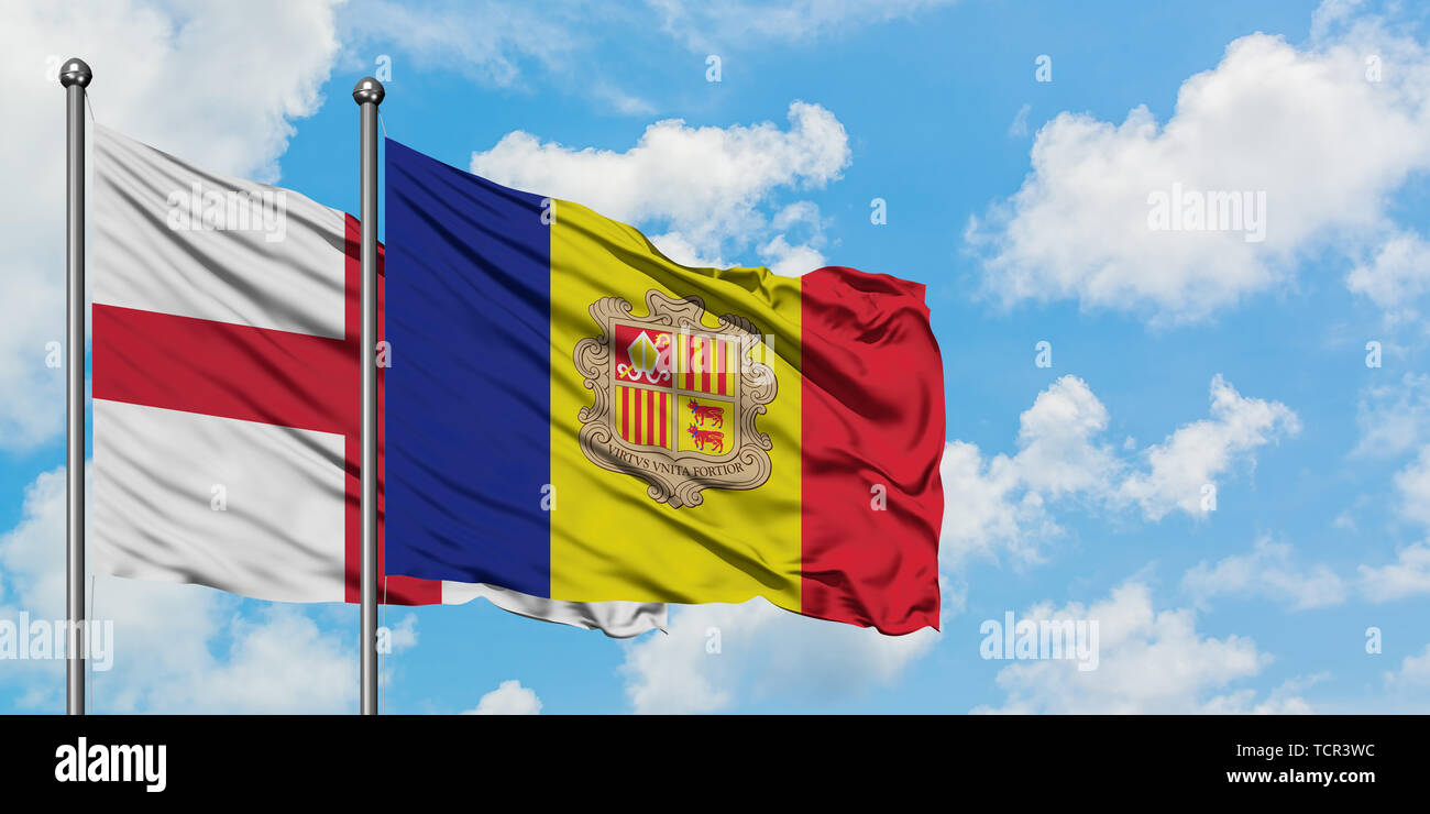England and Andorra flag waving in the wind against white cloudy blue sky together. Diplomacy concept, international relations. Stock Photo