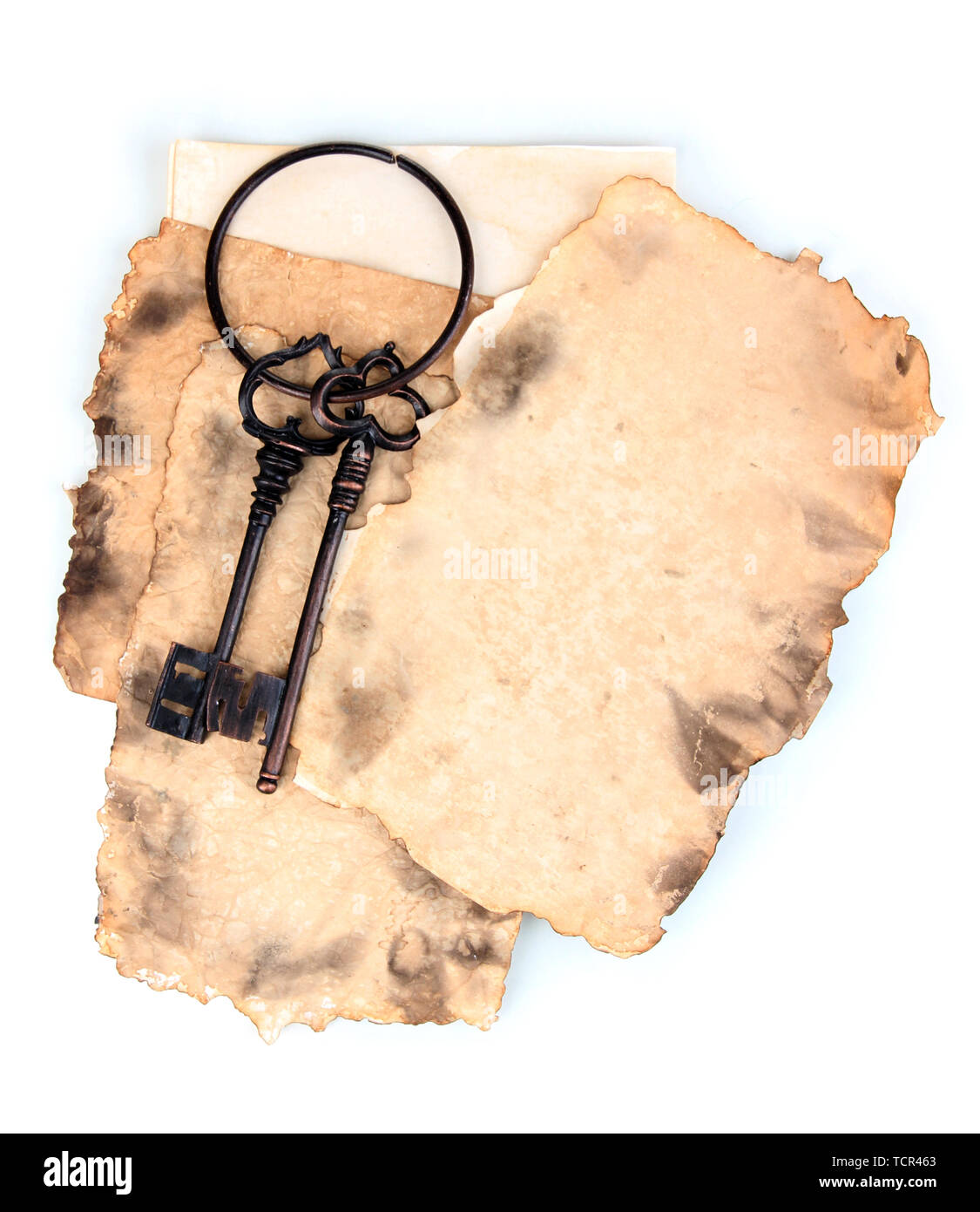 Old paper with key isolated on white Stock Photo - Alamy