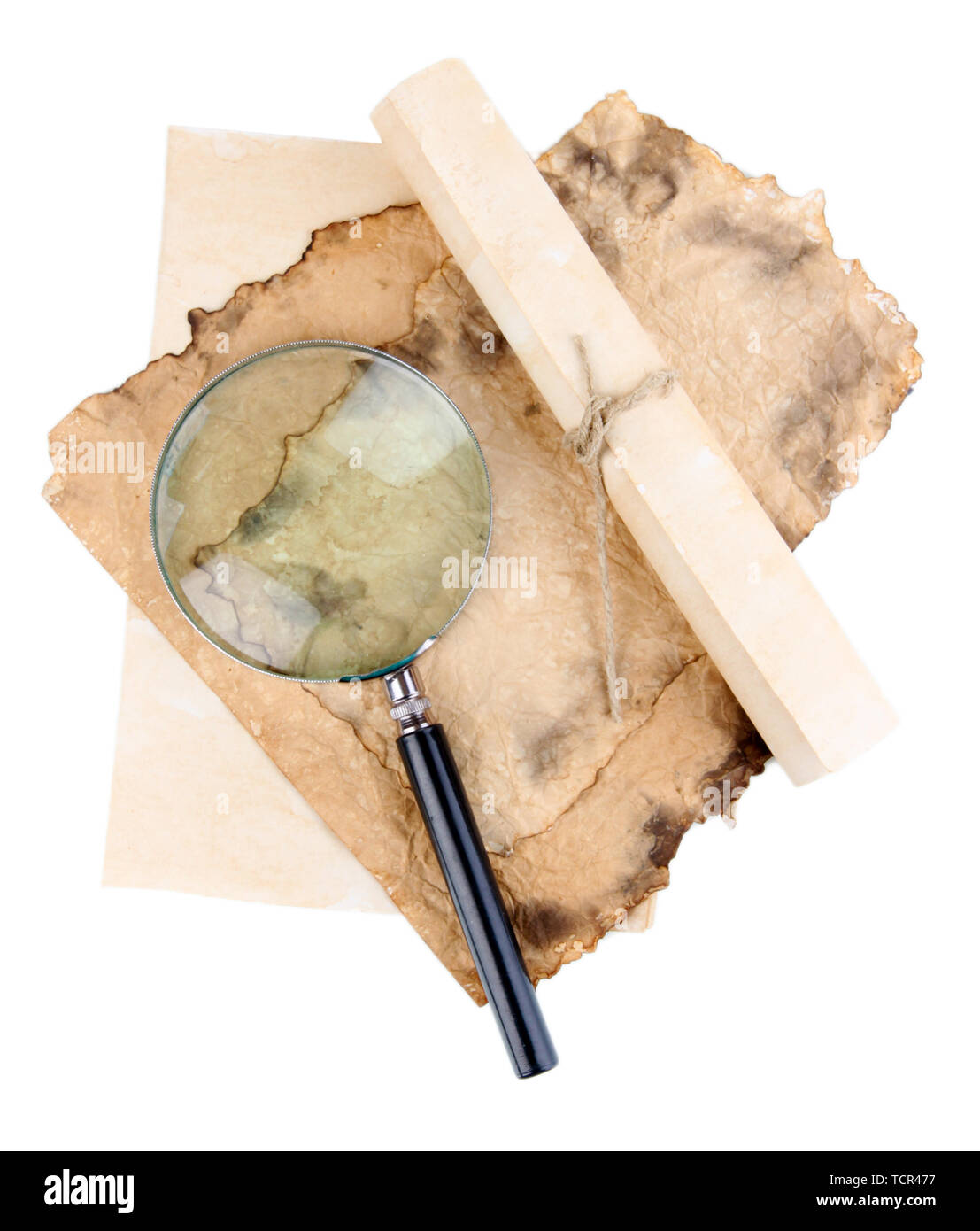 Old paper with magnifying glass isolated on white Stock Photo - Alamy
