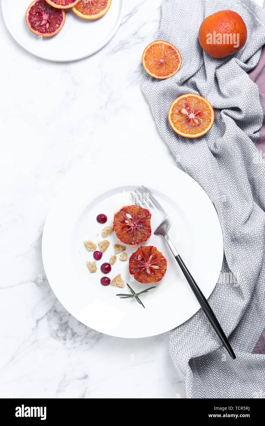 One person eating yogurt cereal fruit breakfast on white background Stock Photo