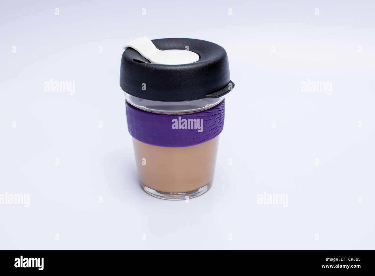 https://c8.alamy.com/comp/TCR6B5/reusable-glass-coffee-mug-with-silicone-sleeve-and-plastic-lid-TCR6B5.jpg