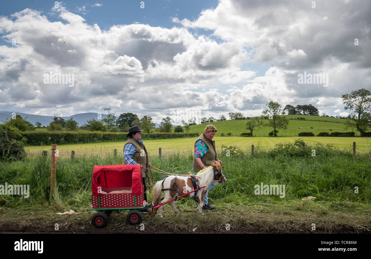 People attend the Appleby Horse Fair, an annual gathering of travellers, in Cumbria. Stock Photo
