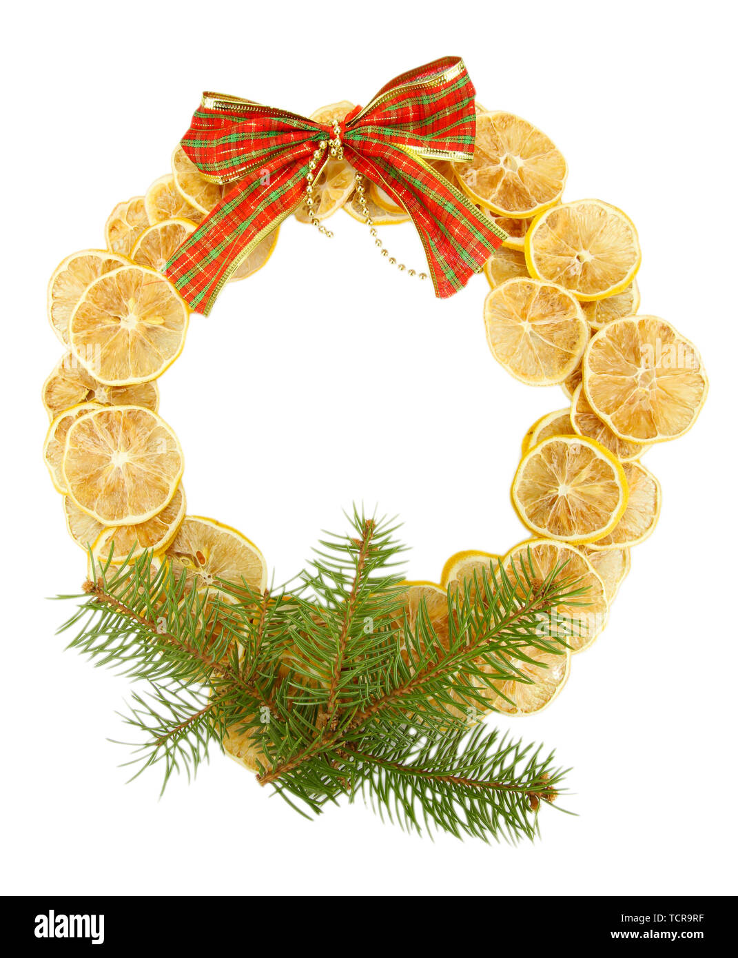 christmas wreath of dried lemons with fir tree and bow isolated on ...
