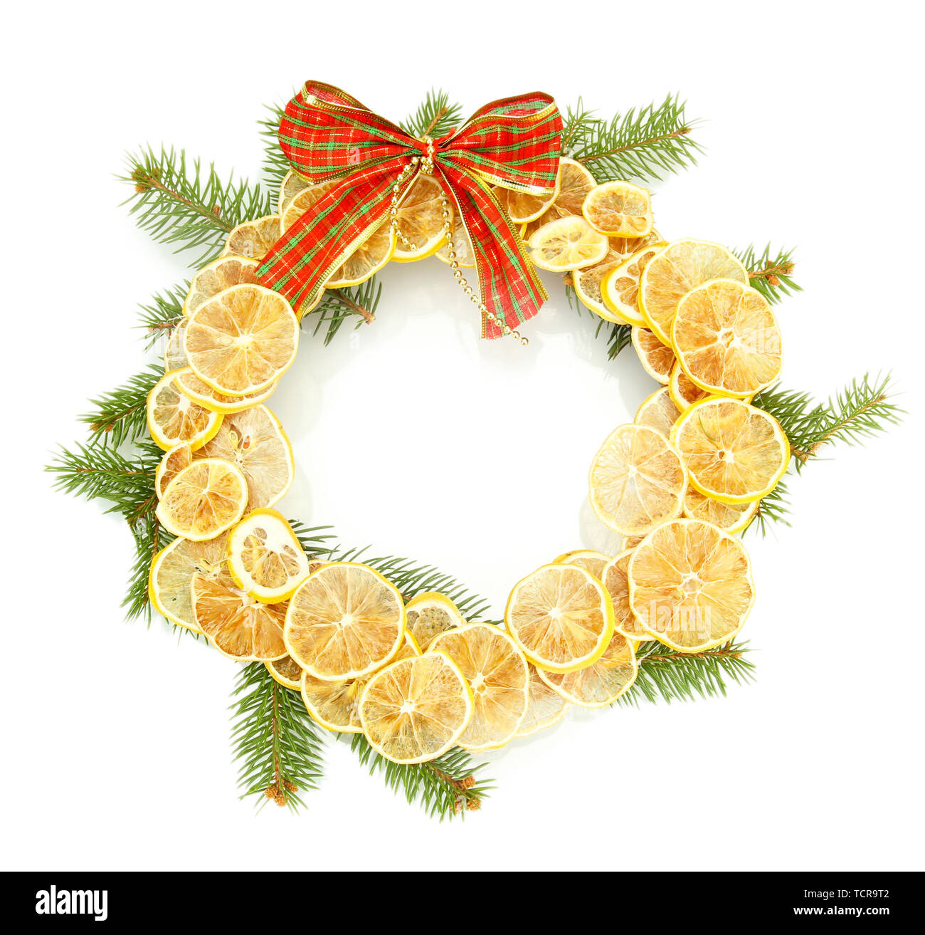 christmas wreath of dried lemons with fir tree and bow isolated on ...