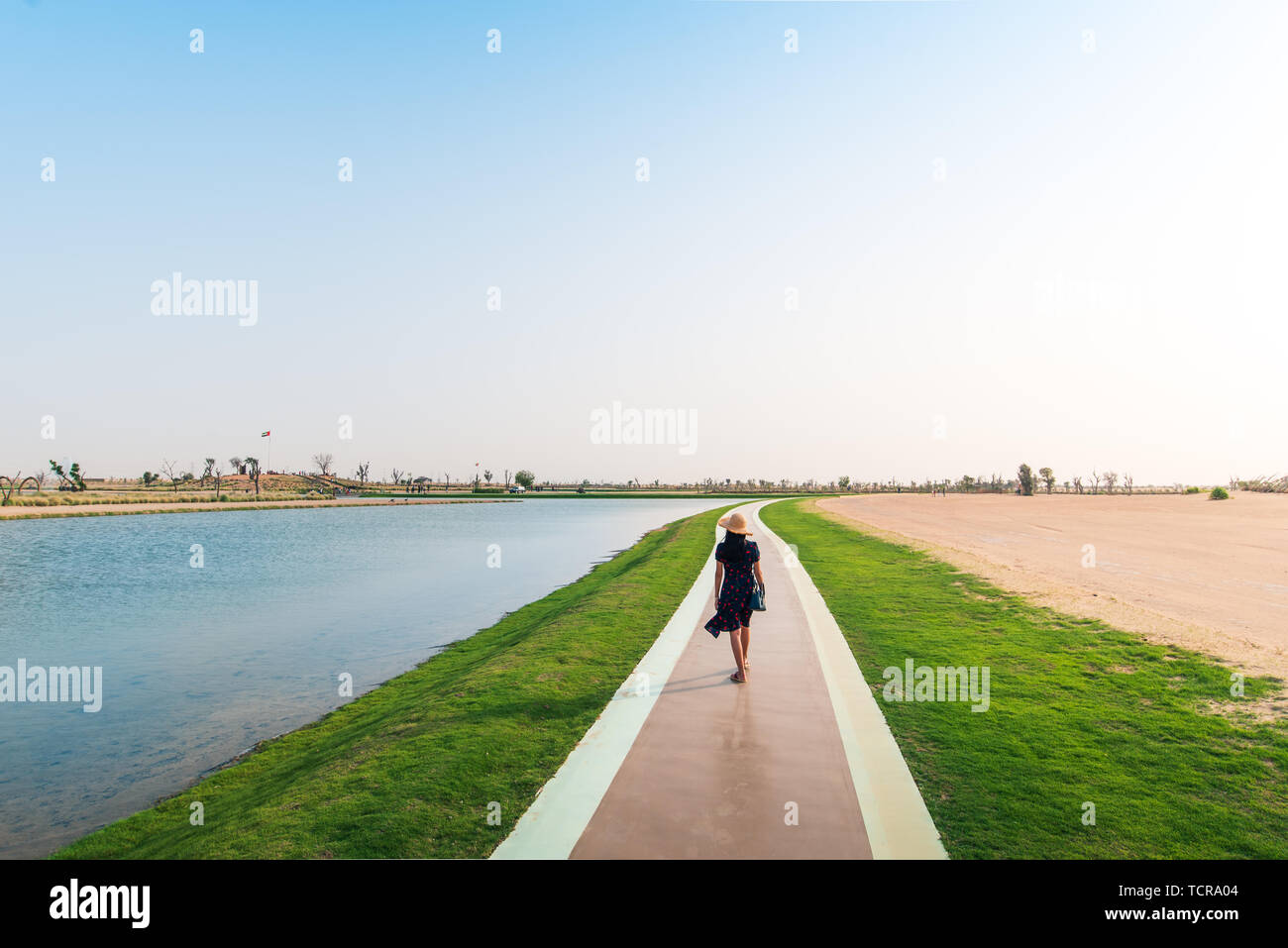 Tourist walking around heart shaped Love lakes in Dubai Stock Photo