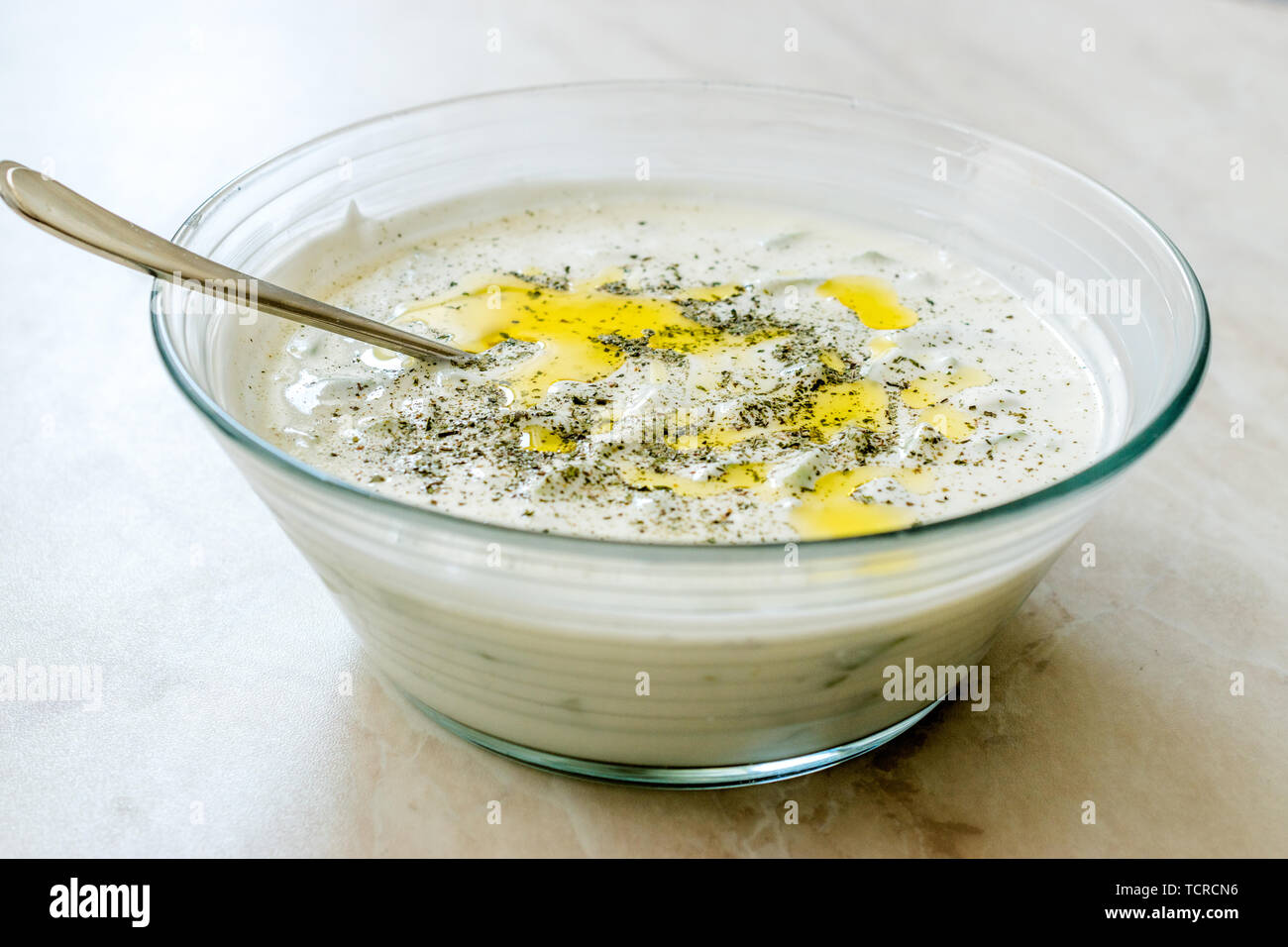 Tzatziki Yogurt with Cucumber, Olive Oil and Thyme Powder / Cacik. Organic Food. Stock Photo