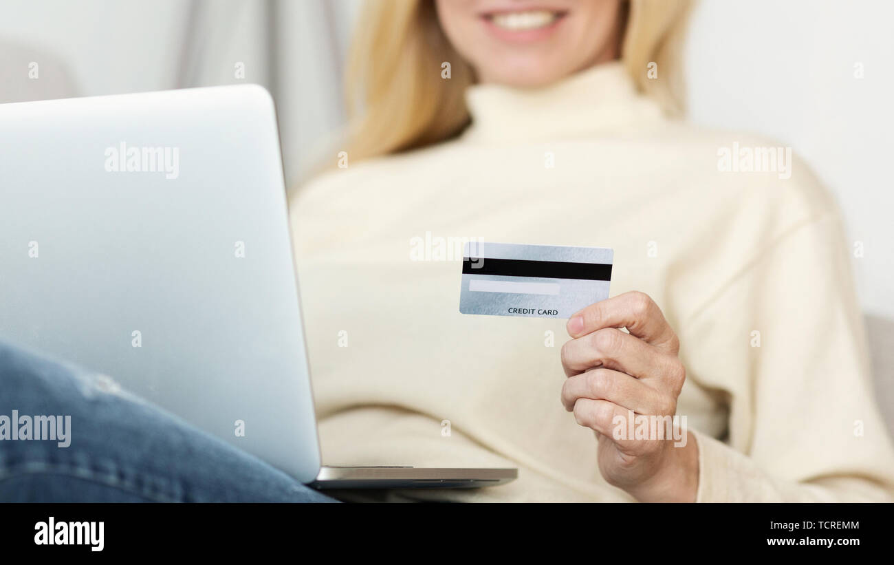 Woman Making Online Payment With Credit Card Stock Photo