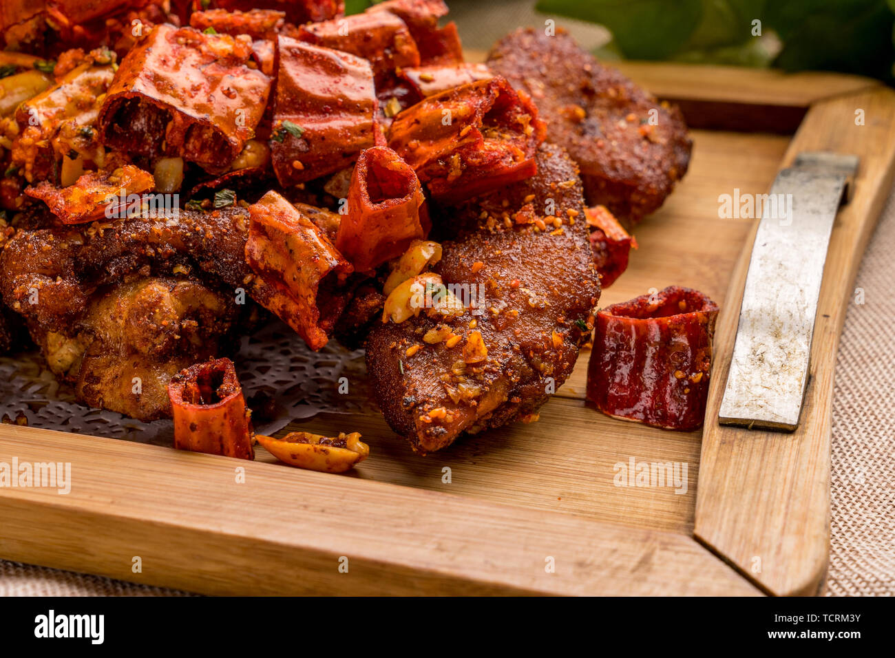 Crispy, spicy, roasted pig's feet Stock Photo Alamy