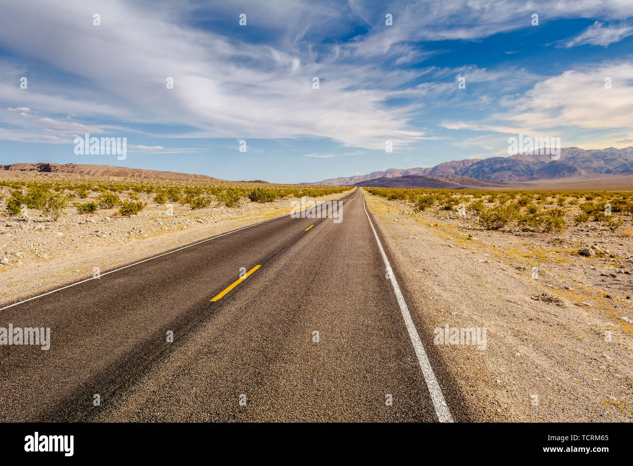 Road through a desert and mountains in California, USA Stock Photo - Alamy