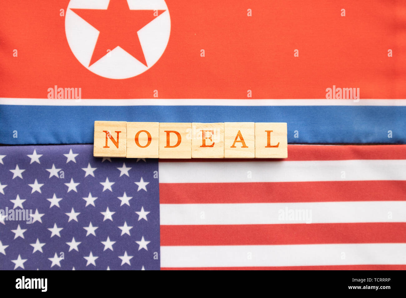 Concept of bilateral relations of USA and North Korea showing with flag and Nodeal in wooden block letters Stock Photo