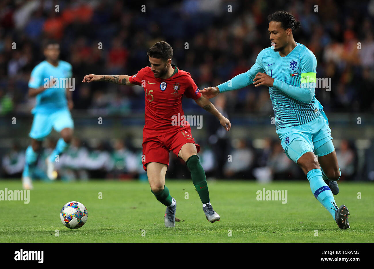 Portugal's Rafa Silva (left) and Netherlands' Virgil van Dijk battle for the ball during the Nations League Final at Estadio do Dragao, Porto. Stock Photo