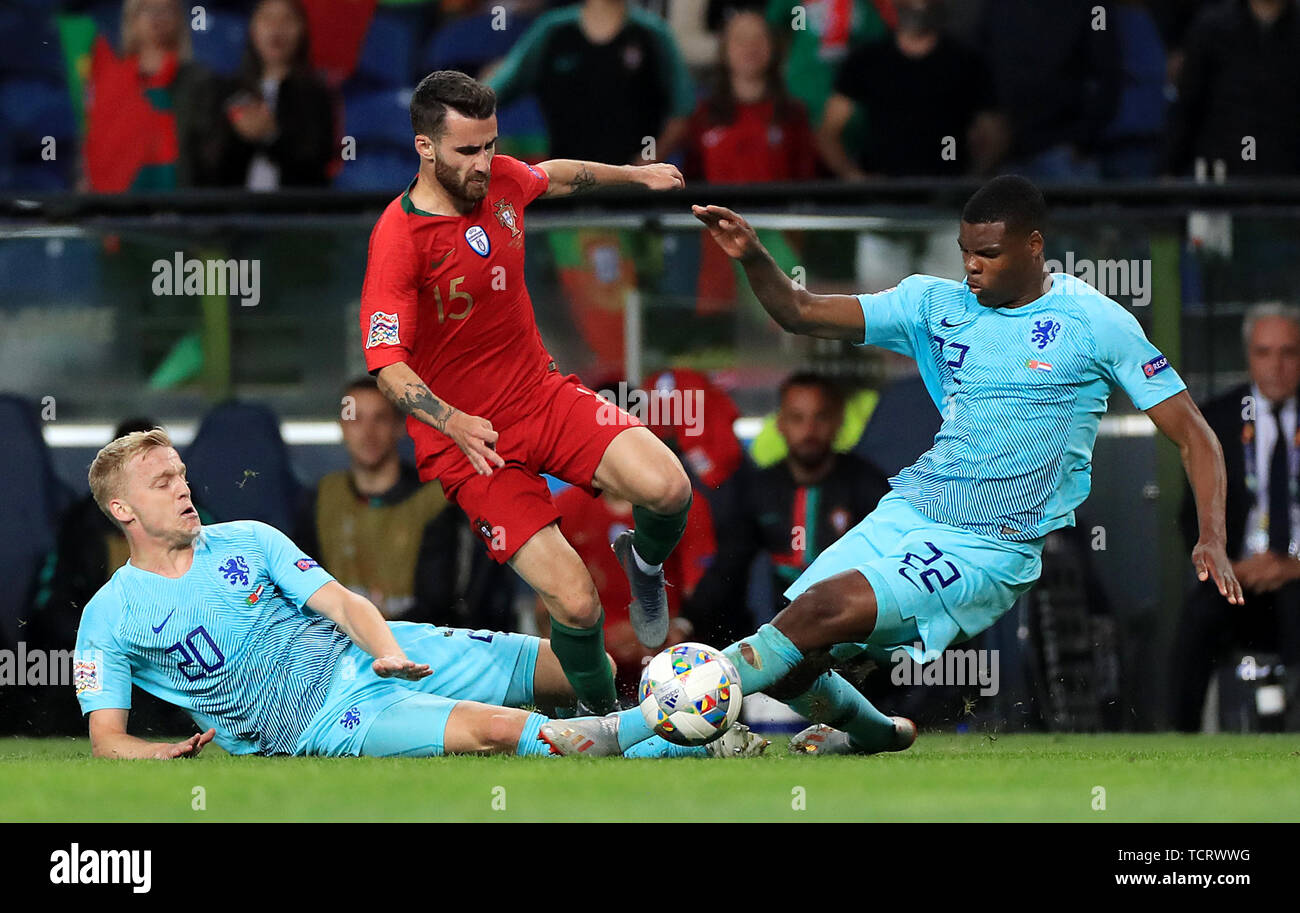 Netherlands' (left-right) Donny van de Beek, Portugal's Rafa Silva, and Netherlands' Denzel Dumfries battle for the ball during the Nations League Final at Estadio do Dragao, Porto. Stock Photo