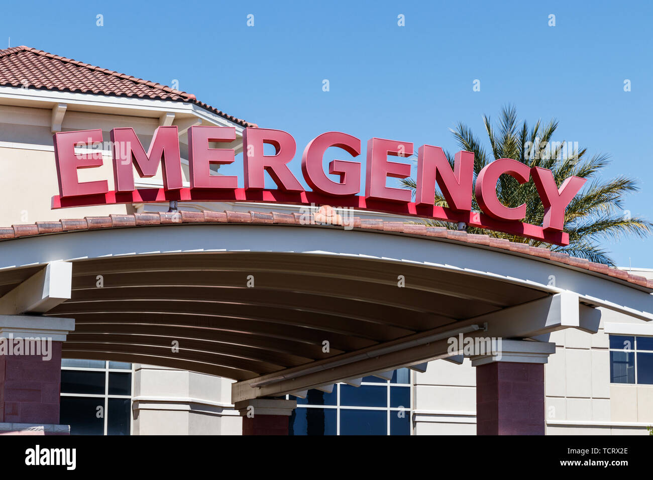 Red Emergency Entrance Sign for a Local Hospital Stock Photo