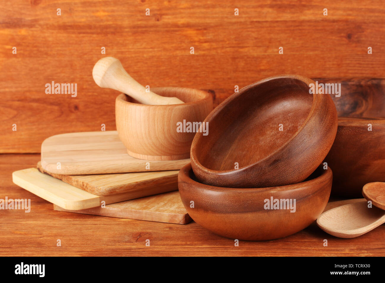 Wooden kitchen utensils on wooden background Stock Photo - Alamy