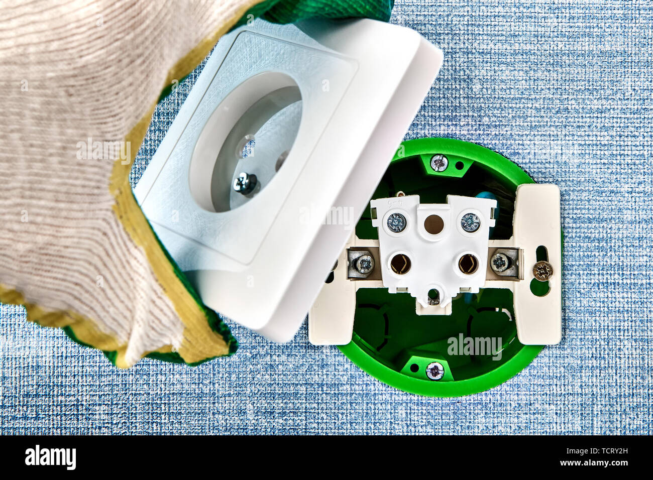 Electrical installation and repairs, installing new power points. Stock Photo