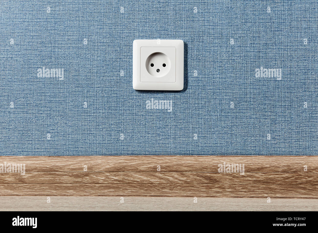 Euro electric outlet type C, electrical point of power in house, on the blue wall background. Stock Photo