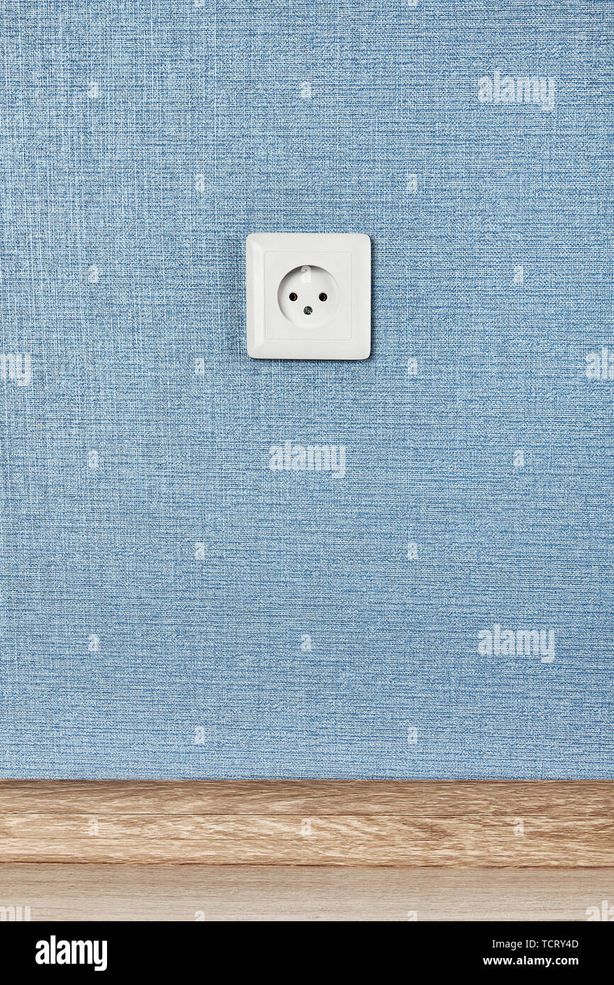 European power socket type C, electrical point of power at home, on the blue background. Stock Photo