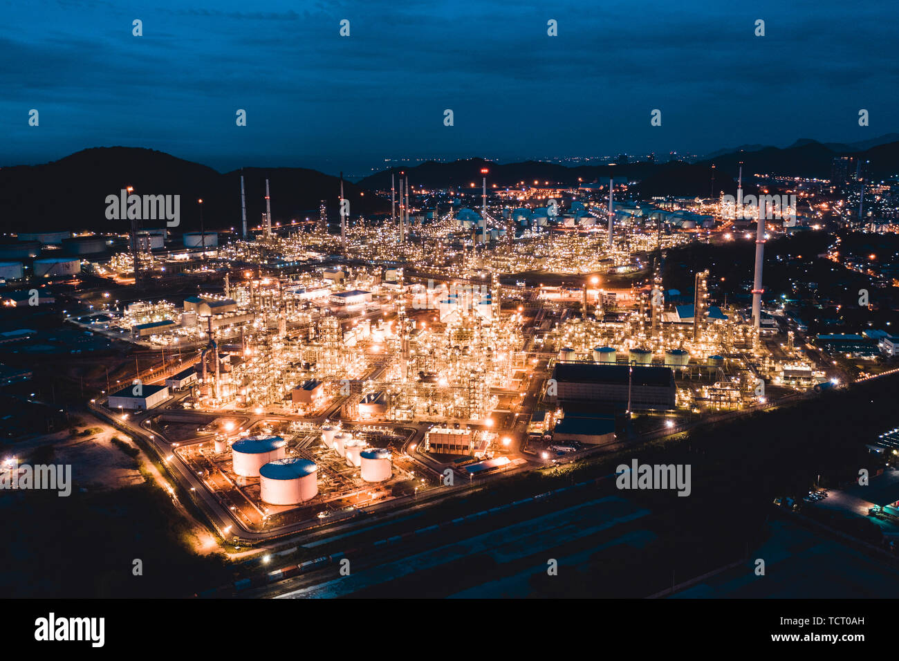 Aerial view of petroleum oil refinery in industrial estate at twilight. Fuel and power generation, petrochemical factory industry concept Stock Photo