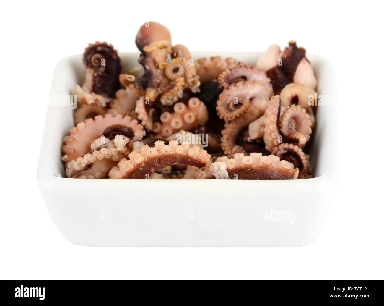 Tentacles of octopus in bowl isolated on white Stock Photo - Alamy