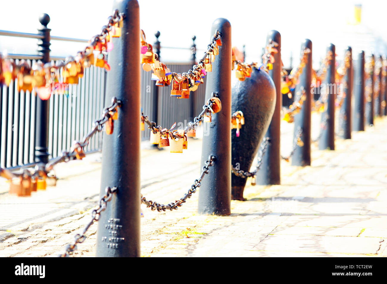 Love locks attached to the railings by the side of the River Mersey on