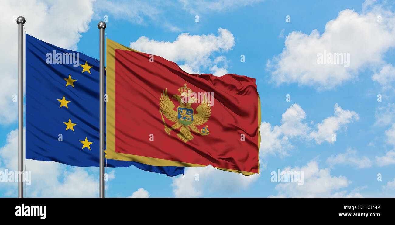 European Union and Montenegro flag waving in the wind against white ...
