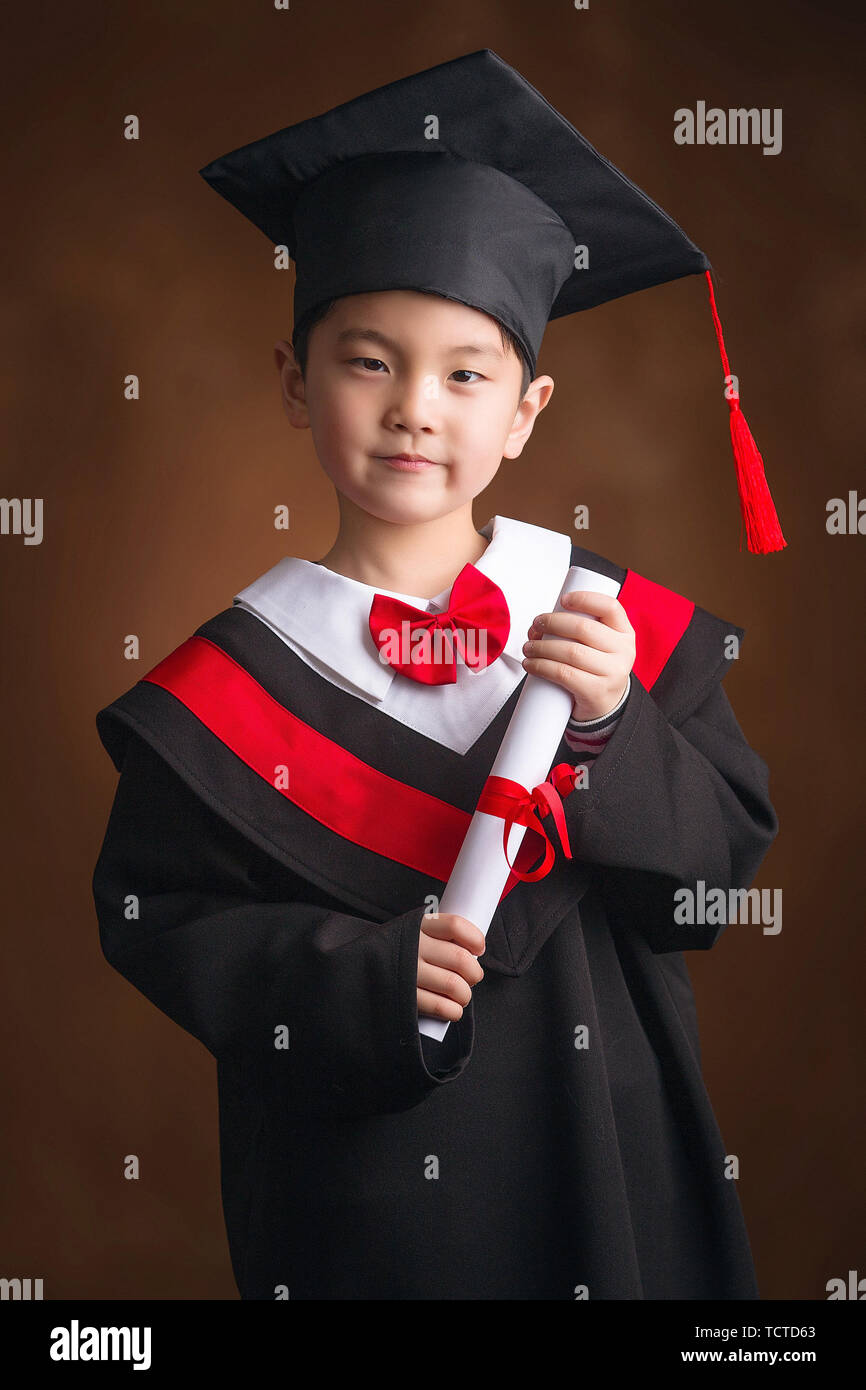 Handsome little boy in a graduation suit Stock Photo Alamy