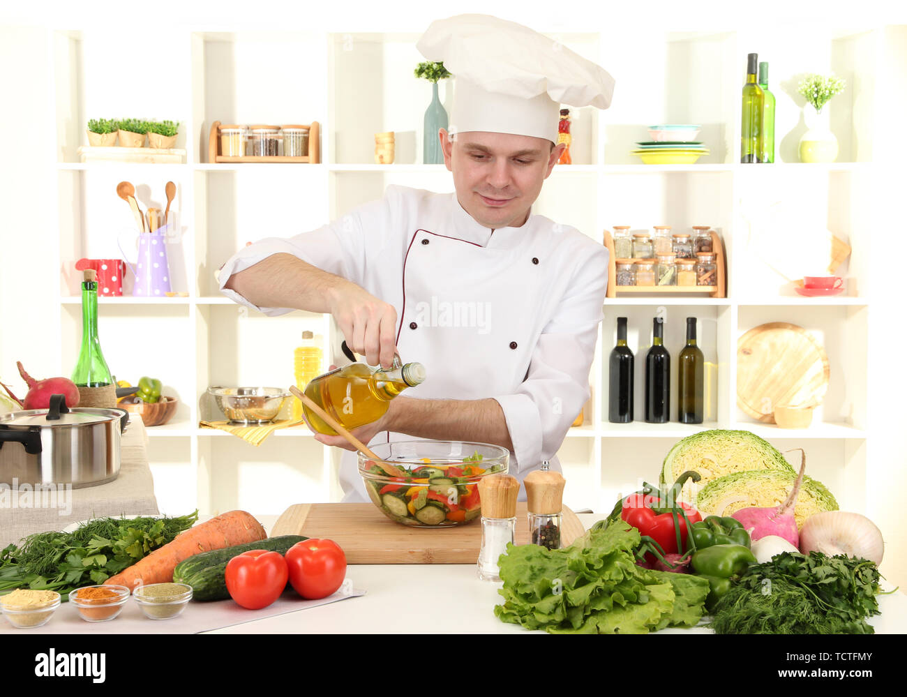 Chef cooking in kitchen Stock Photo - Alamy