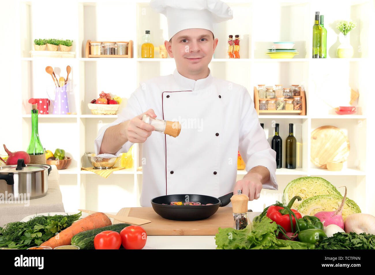 Chefi Coocking Chef cooking in kitchen Stock Photo - Alamy