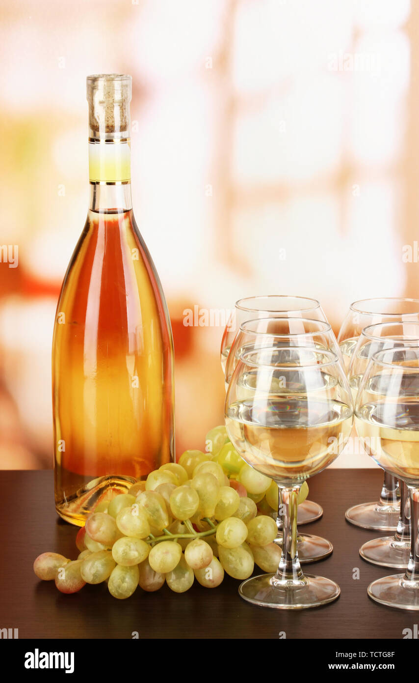 White wine in glass and bottle on room background Stock Photo Alamy