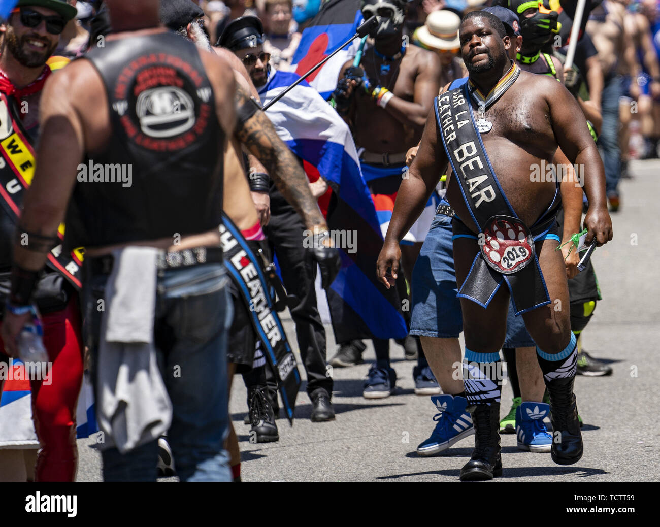 Los Angeles, California, USA. 15th Mar, 2019. A man wears a sash that says Mr. LA Leather Bear during the LA Pride Parade in West Hollywood, California.The 49th annual gay pride parade includes a music festival and a parade that draws large crowds. Credit: Ronen Tivony/SOPA Images/ZUMA Wire/Alamy Live News Stock Photo