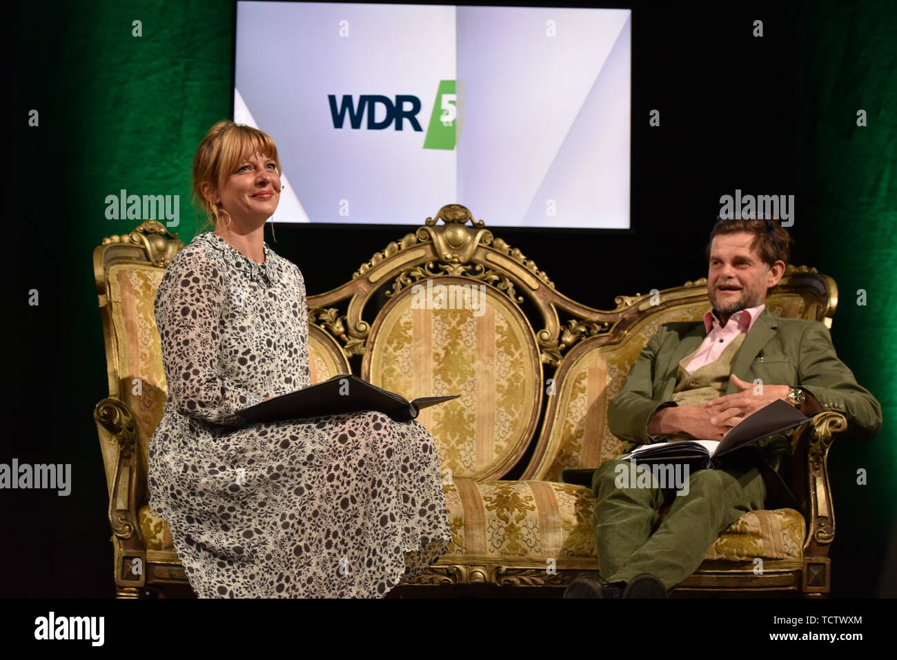 Cologne, Germany. 09th June, 2019. The actors Jördis Triebel and Lars Rudolph sit on a sofa and read Diderot at the 7th phil.cologne, the biggest German philosophy festival. Credit: Horst Galuschka/dpa/Alamy Live News Stock Photo