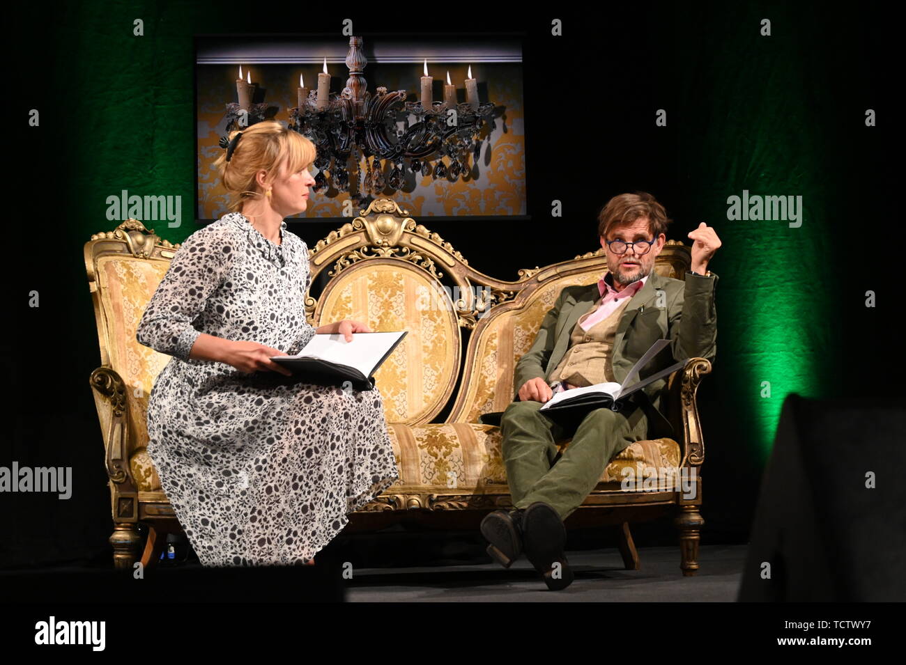 Cologne, Germany. 09th June, 2019. The actors Jördis Triebel and Lars Rudolph sit on a sofa and read Diderot at the 7th phil.cologne, the biggest German philosophy festival. Credit: Horst Galuschka/dpa/Alamy Live News Stock Photo