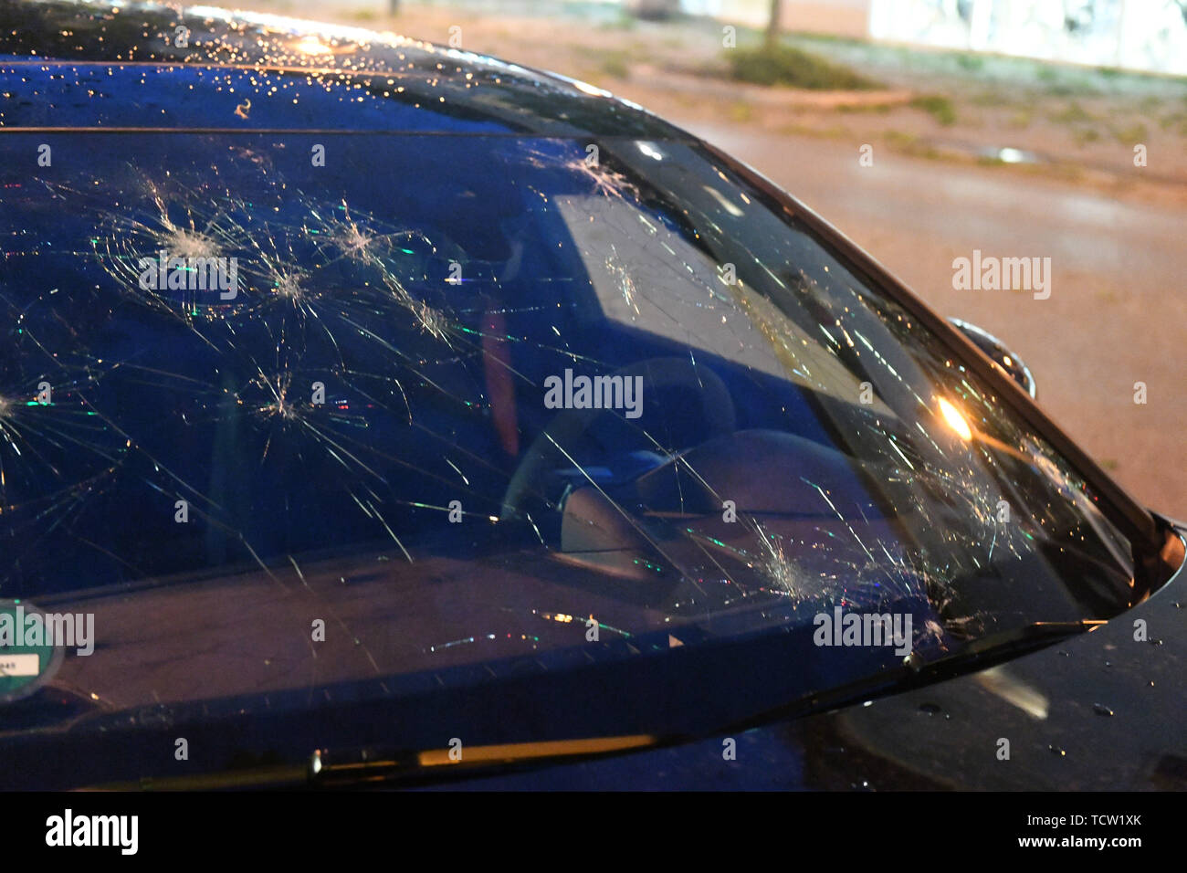 Germering, Germany. 10th June, 2019. ILLUSTRATION - A window pane of a car damaged by hail in a storm. Credit: Felix Hörhager/dpa/Alamy Live News Stock Photo