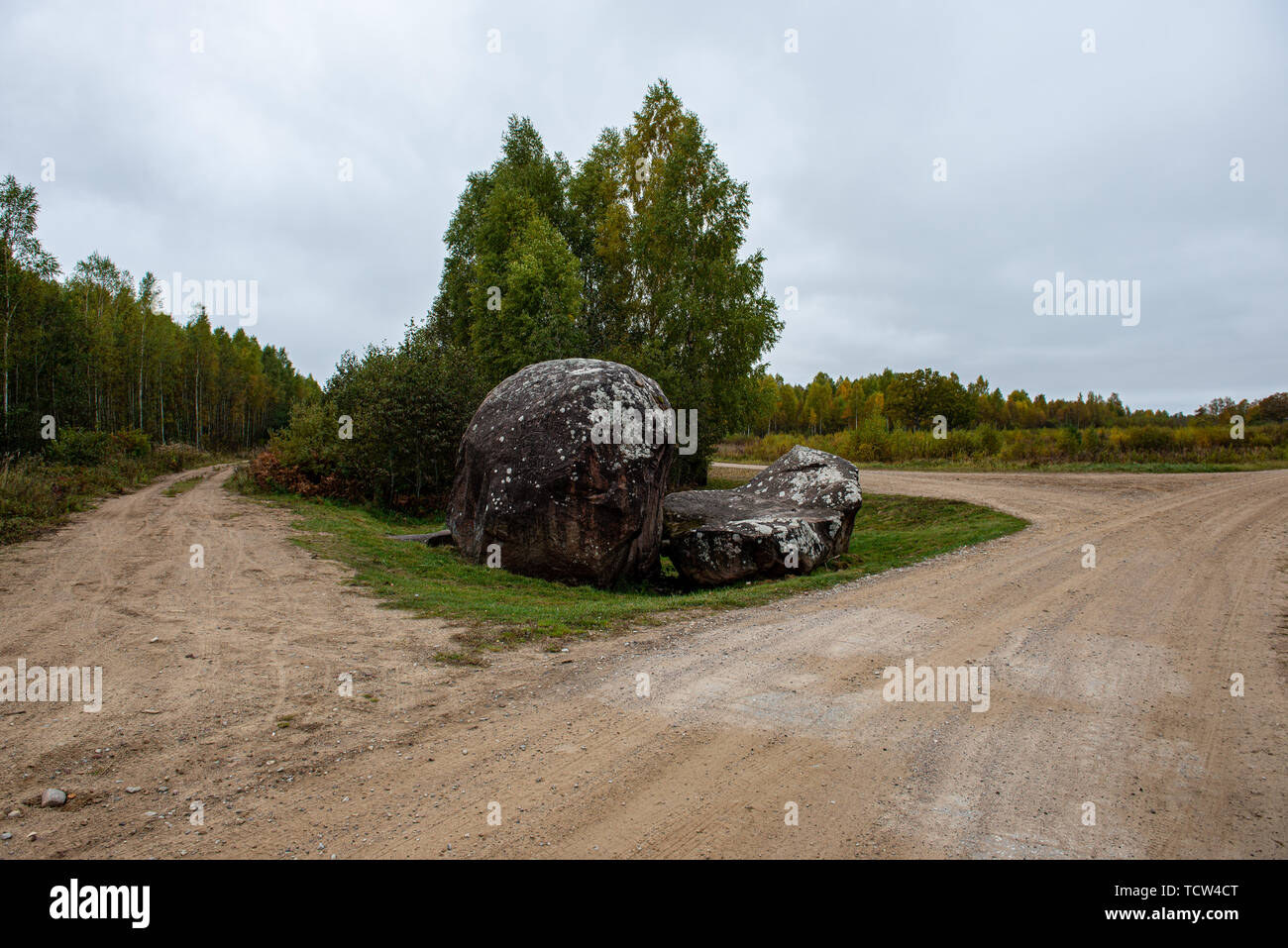 large rock in sand in countryside, isolated stone Stock Photo - Alamy