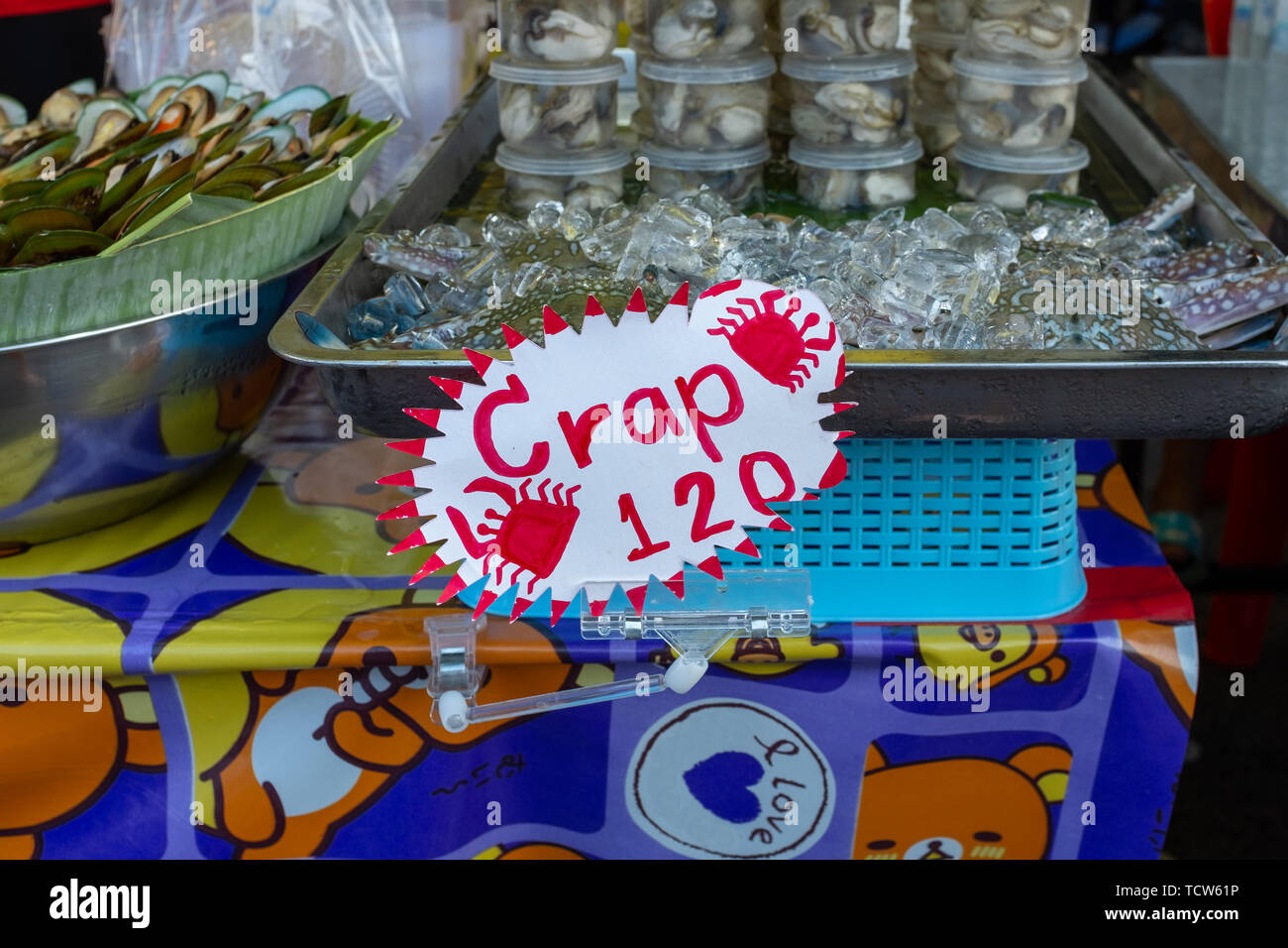 A misspelt food sign at a street food market stall in Krabi, Thailand, the sign reads Crap when it should be Crab, nobody in the image Stock Photo
