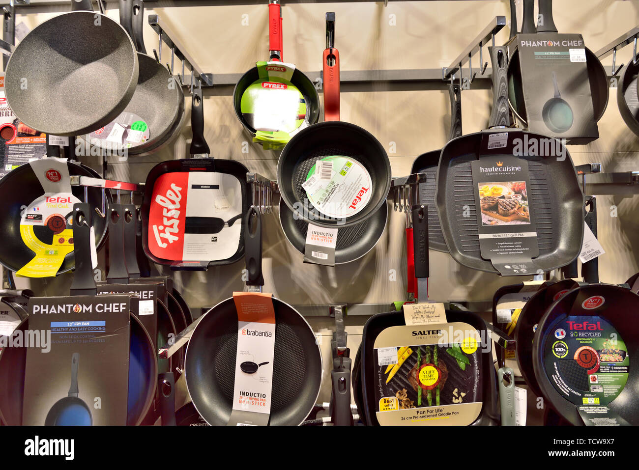 Display of frying pans on sale in store Stock Photo