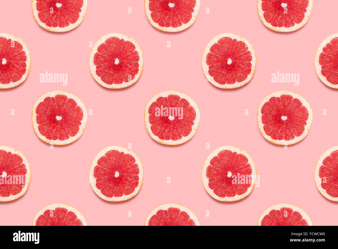 Grapefruit slices tropical seamless pattern on pink background Minimal ...