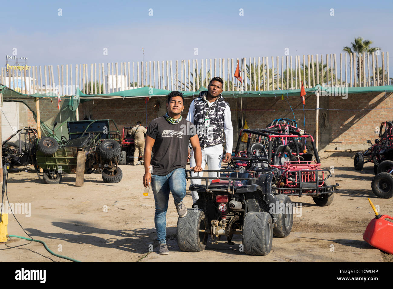 Portrait of two guys at a quad bike center in Paracas, Peru, South America, Stock Photo