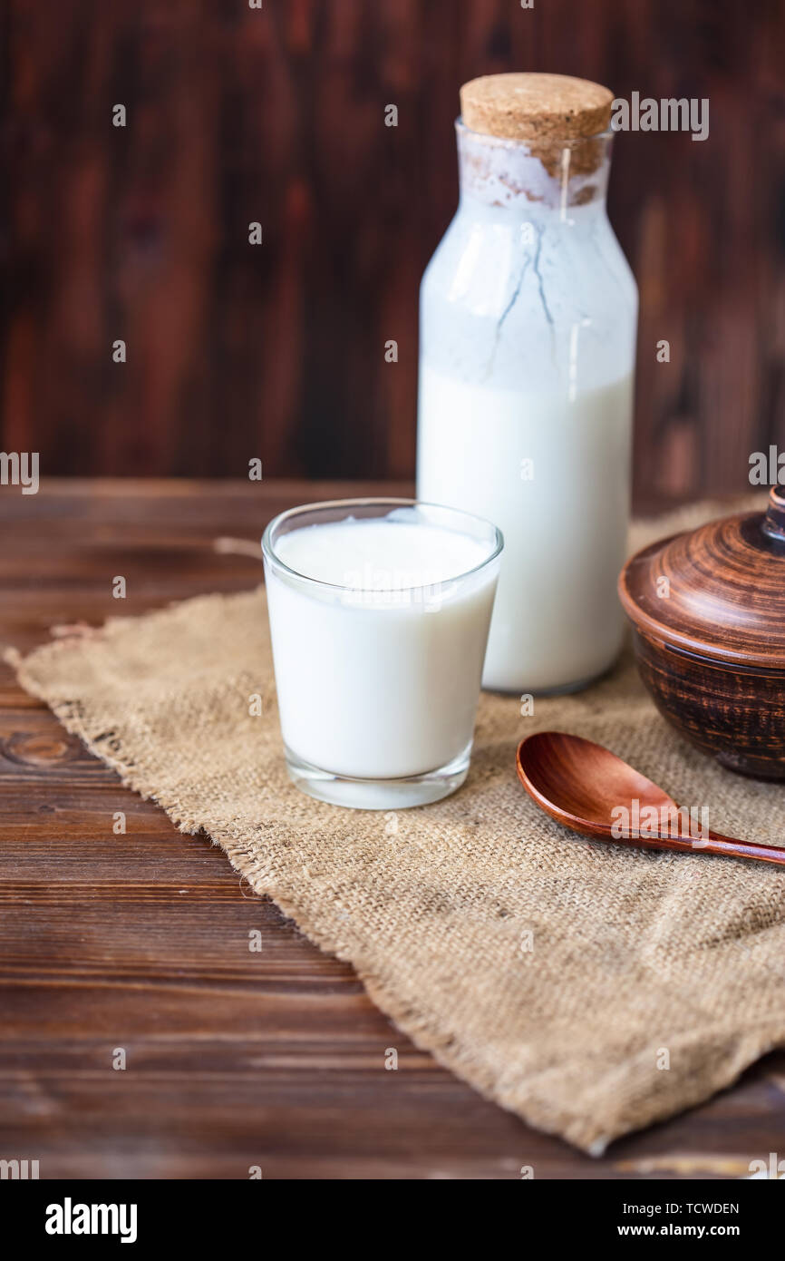 Homemade kefir, yogurt with probiotics in a glass on table Probiotic cold fermented dairy drink