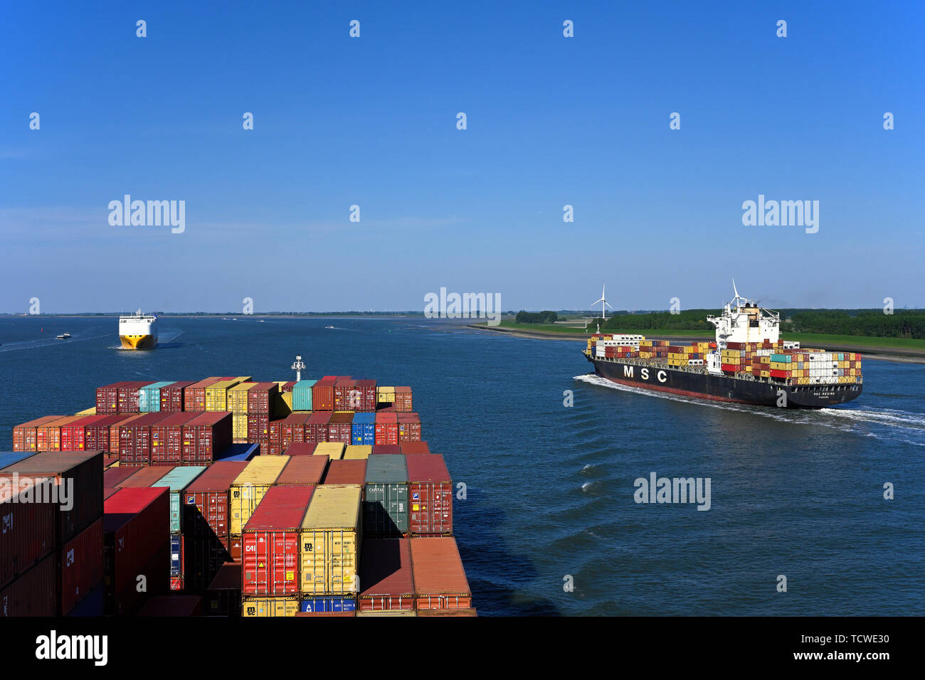 westerschelde, netherlands - 2019.05.15:  cargo ship traffic inbound and outbound to/from antwerp port on river scheldt Stock Photo